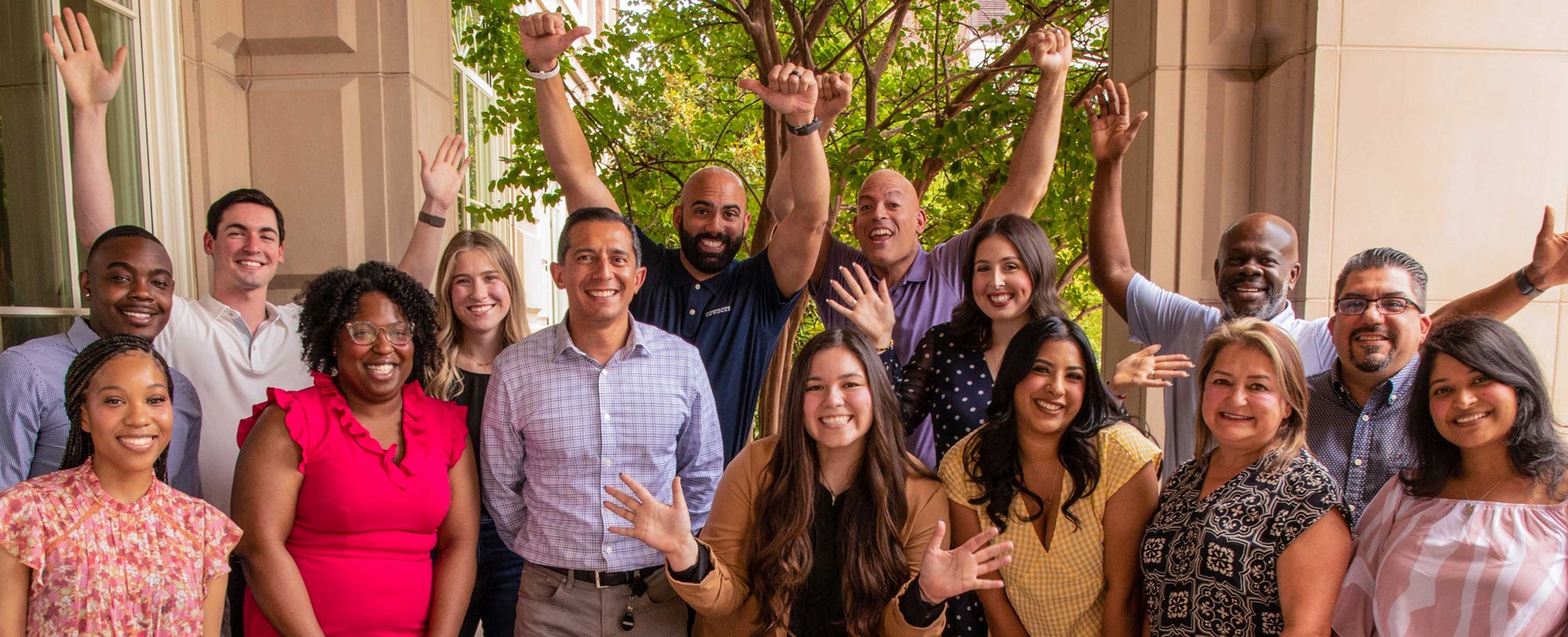 Diverse group of Omni employees outside