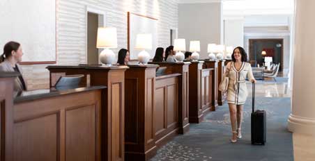 Traveler approaching front desk.