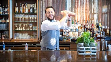 Omni bartender making a drink