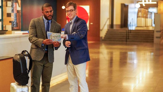 Omni front desk staff assists guest with directions