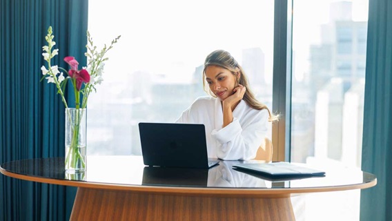 Omni guest uses a laptop in her room