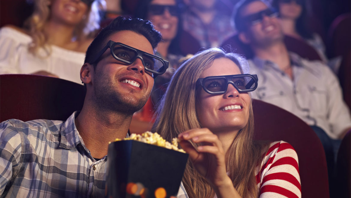 Couple watching movie with popcorn