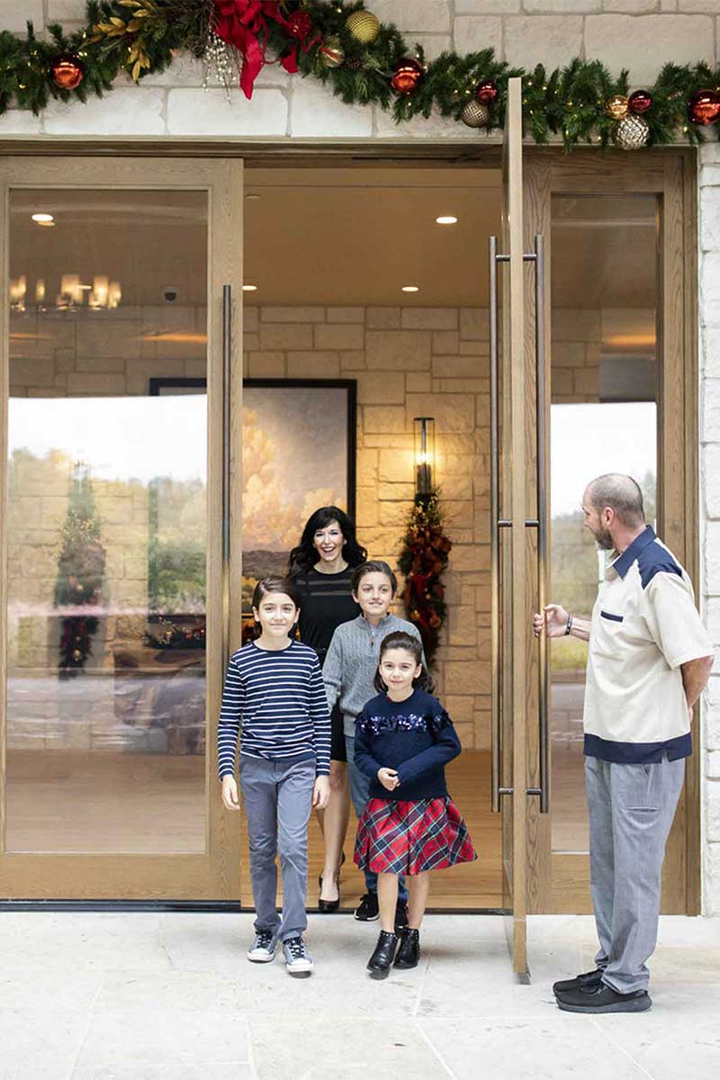 Family walking out of hotel 