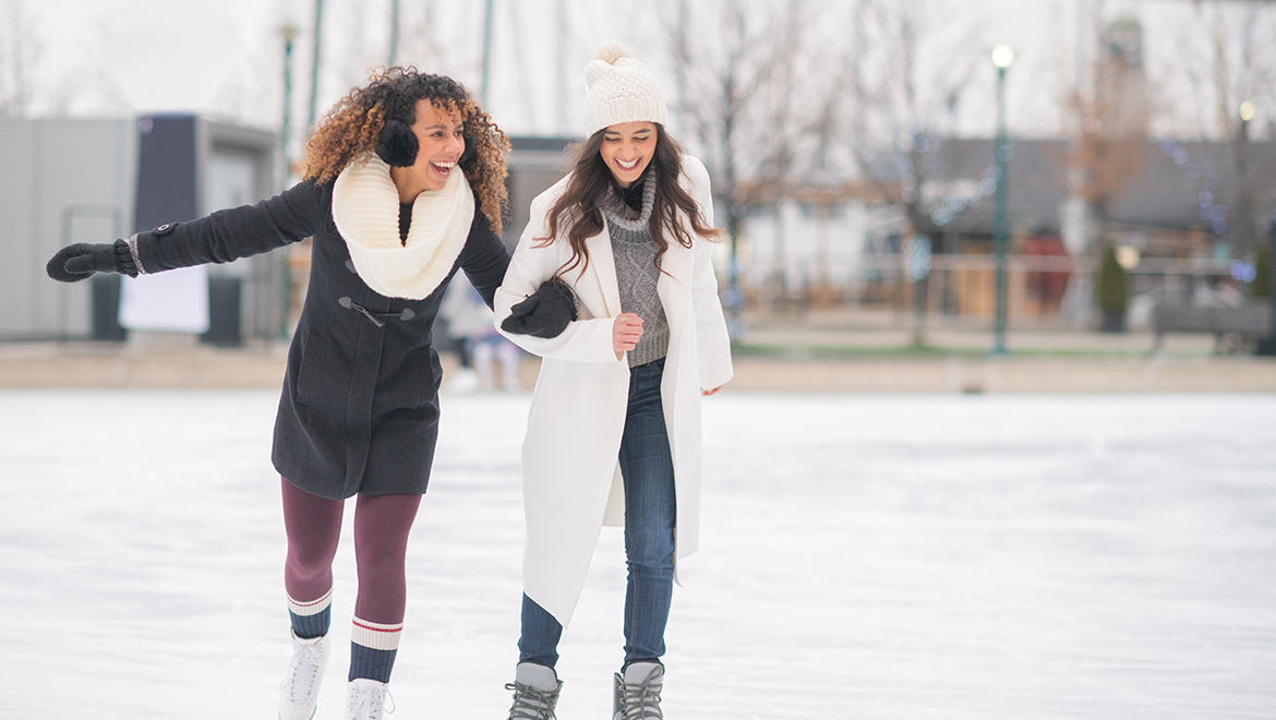 Two girls ice skating