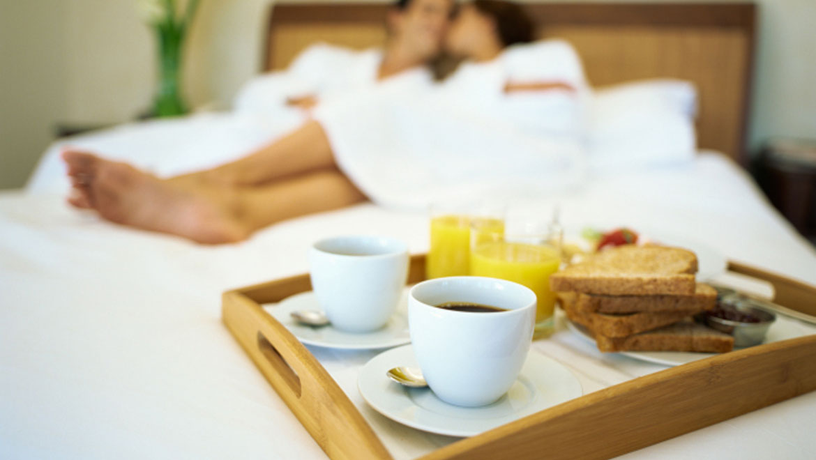 Couple and breakfast in bed