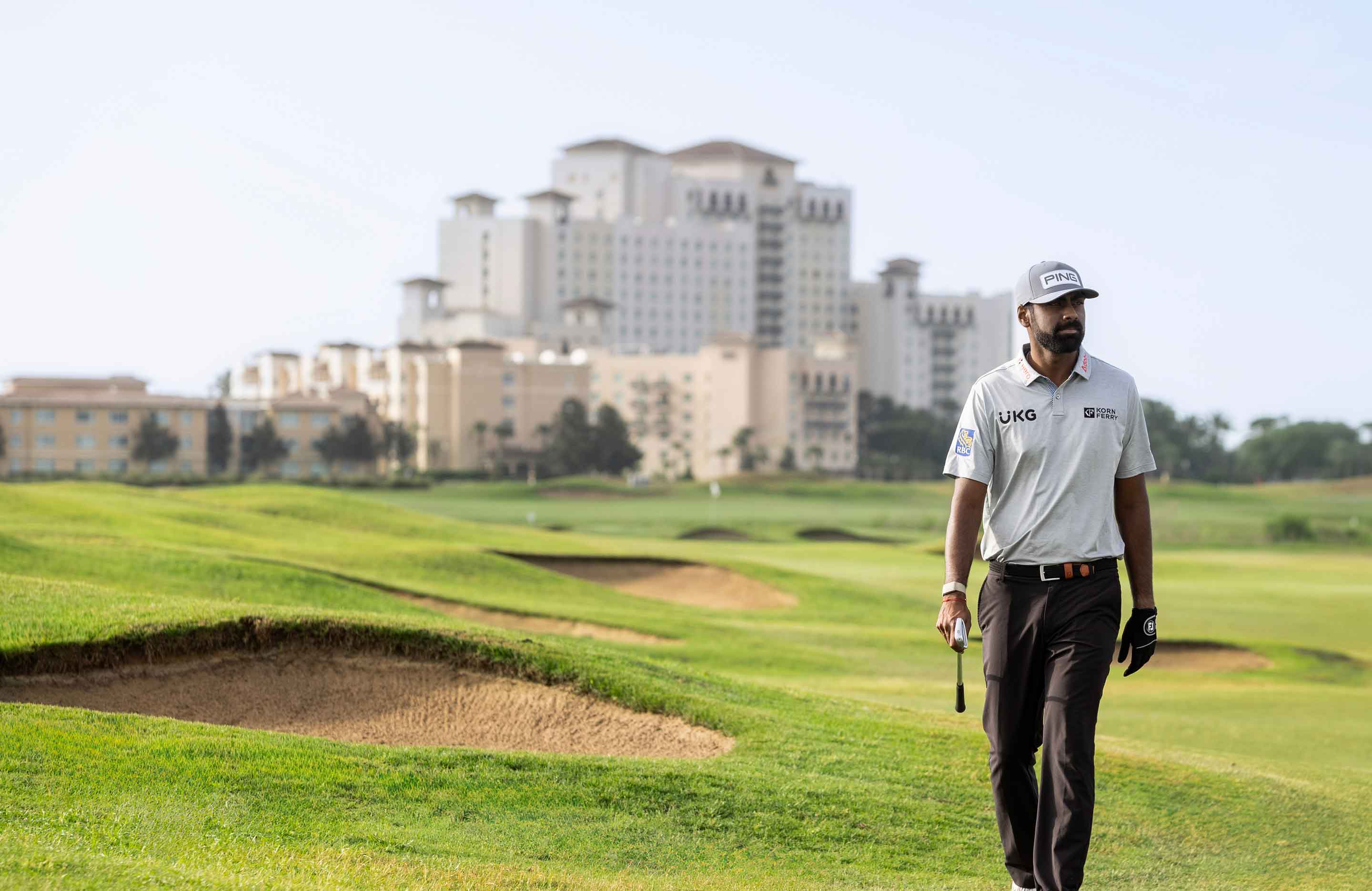 Man walking on a golf course.