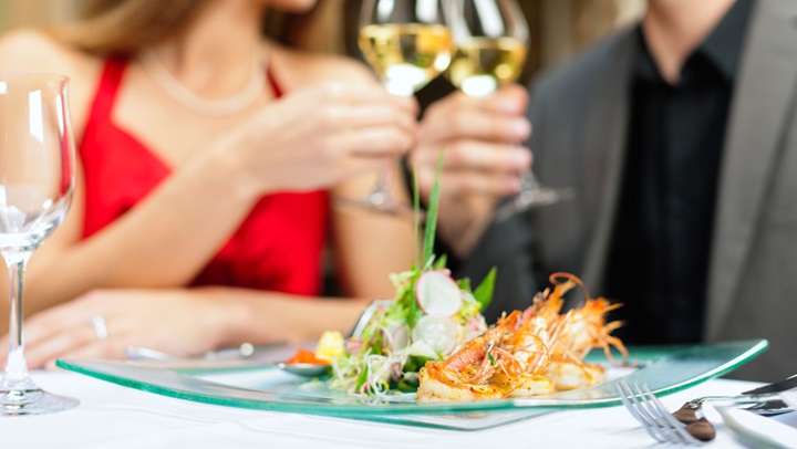 Couple eating and drinking wine