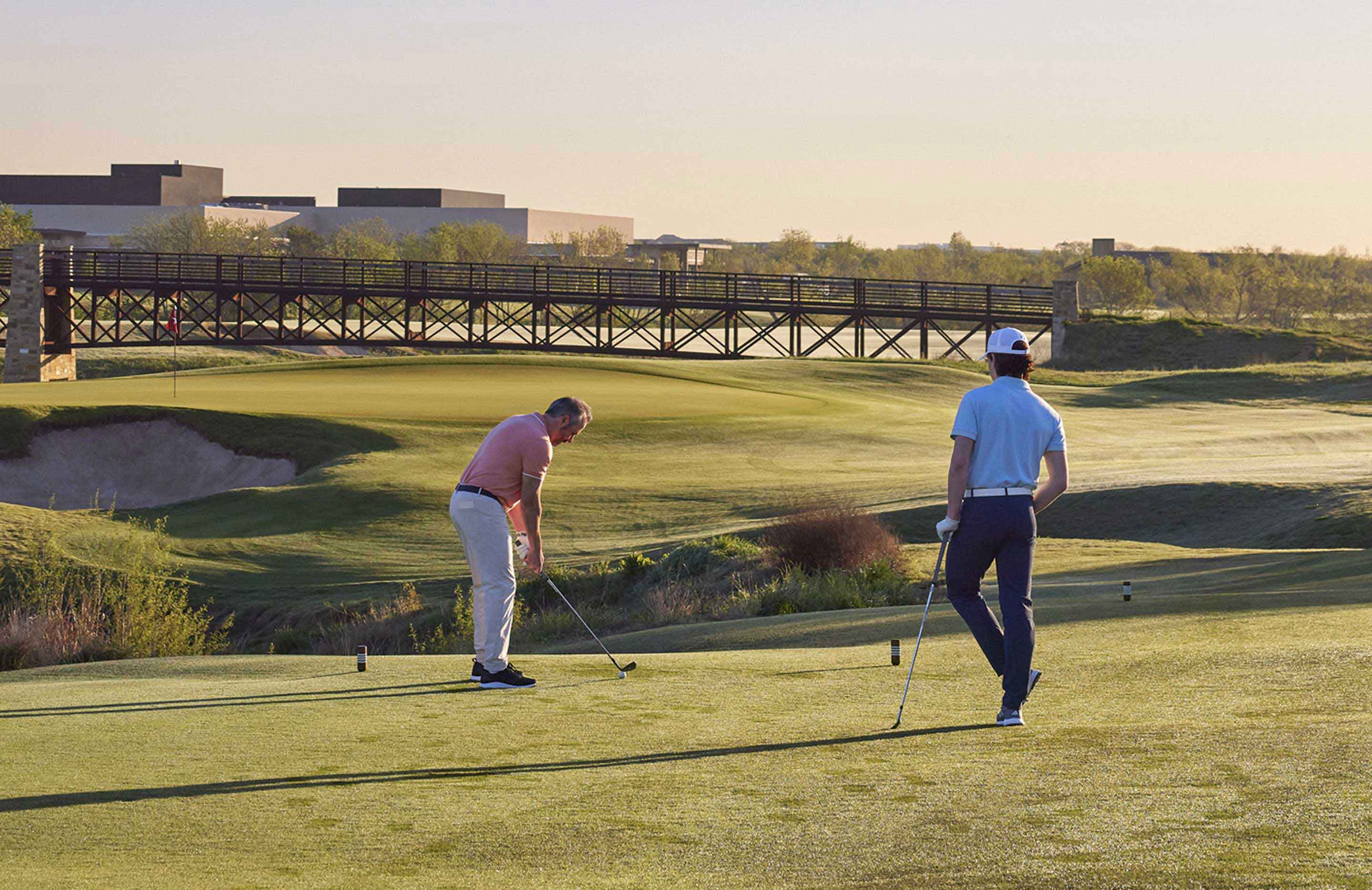 Father and son golfing