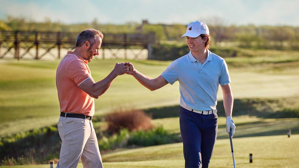 Father and son golfing