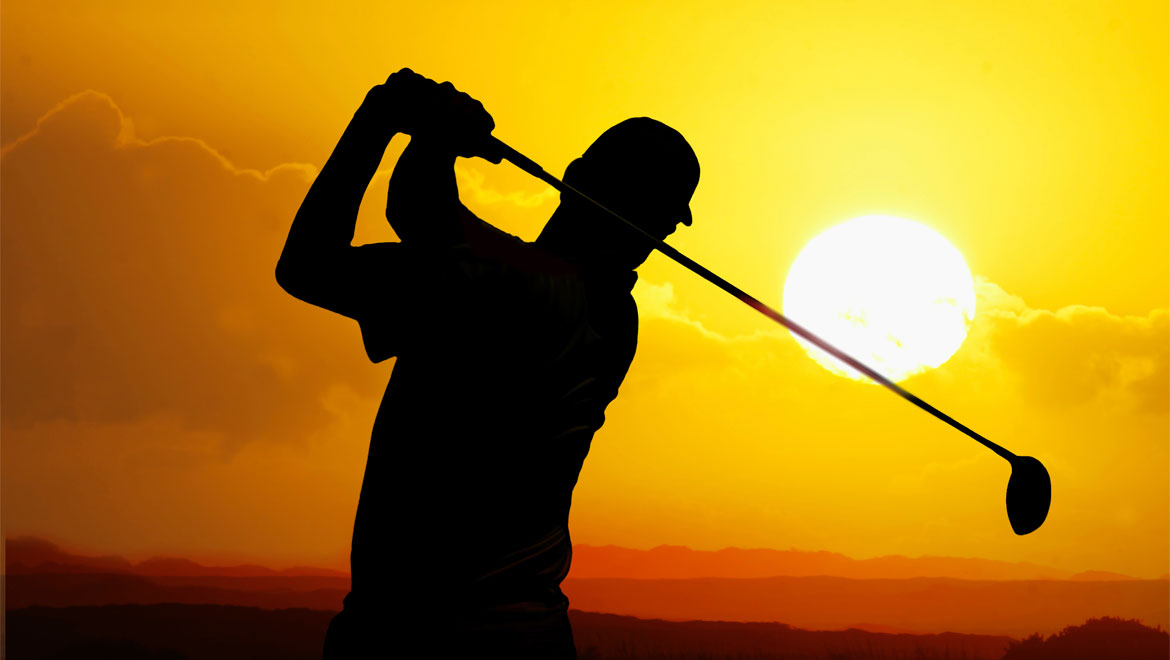 Golfer at sunset