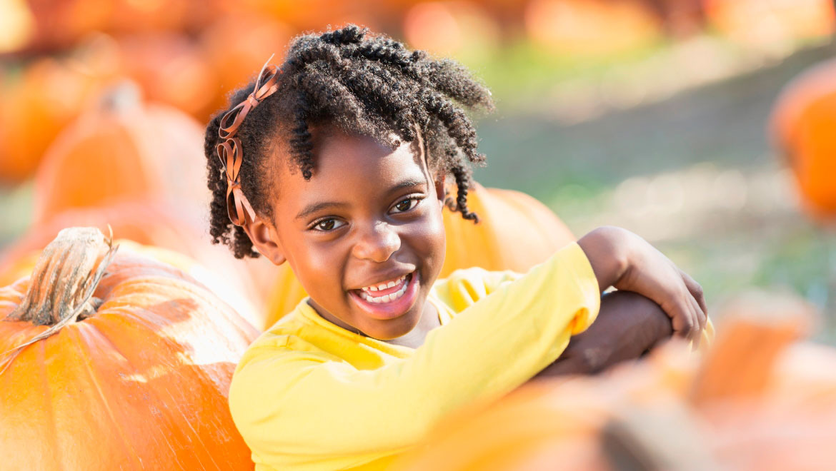 Little girl at pumpkin patch