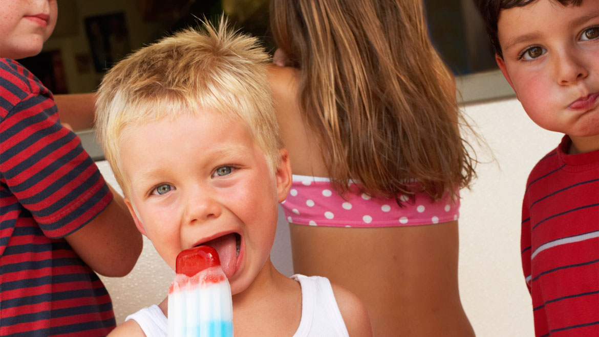 Boy eating popsicle