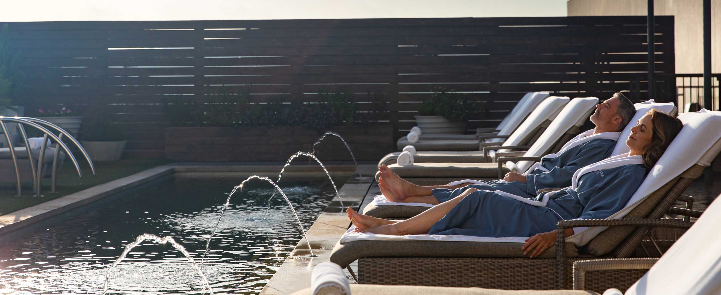 Couple relaxing by the pool