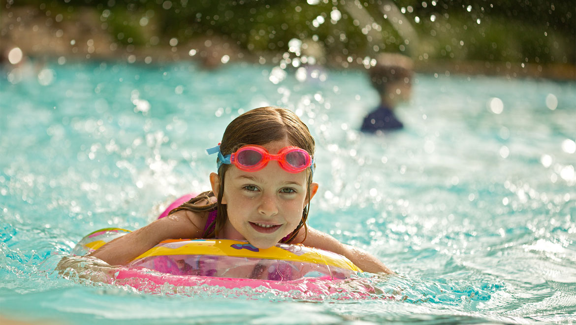 Little girl swimming at Barton Creek