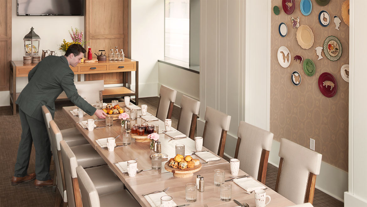 Man setting up Kitchen Notes Private Dining Room