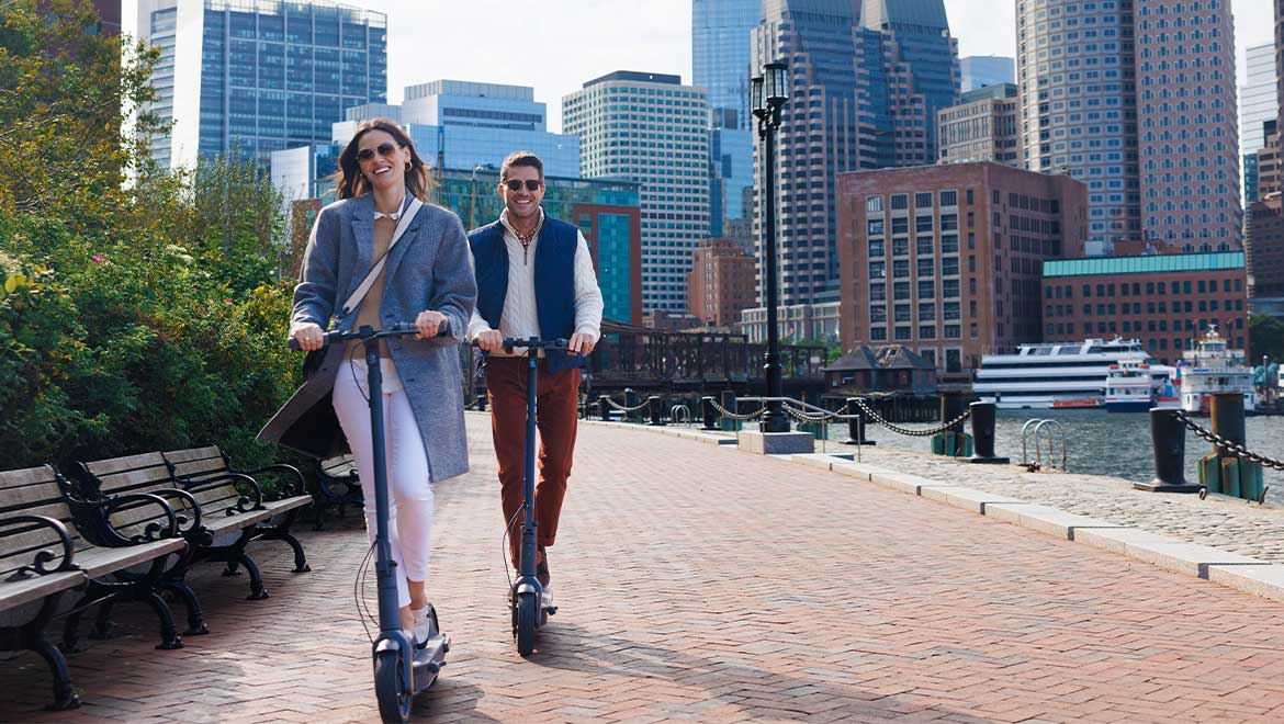 Couple riding electric scooters