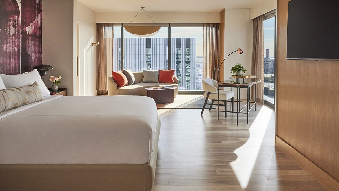 The master bedroom in the Director and Choreographer Suites is adorned with a mural painting of movement in brushstrokes  - Omni Boston Hotel at the Seaport