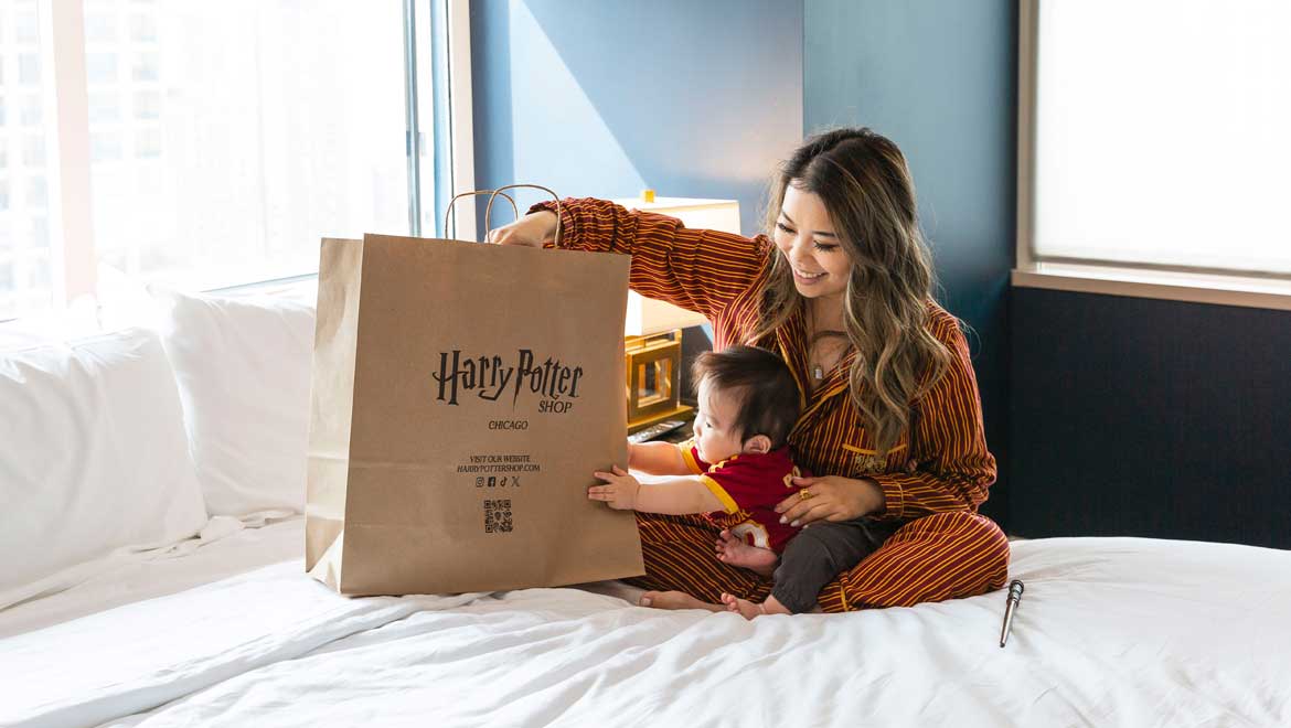 Woman and child with Harry Potter bag.