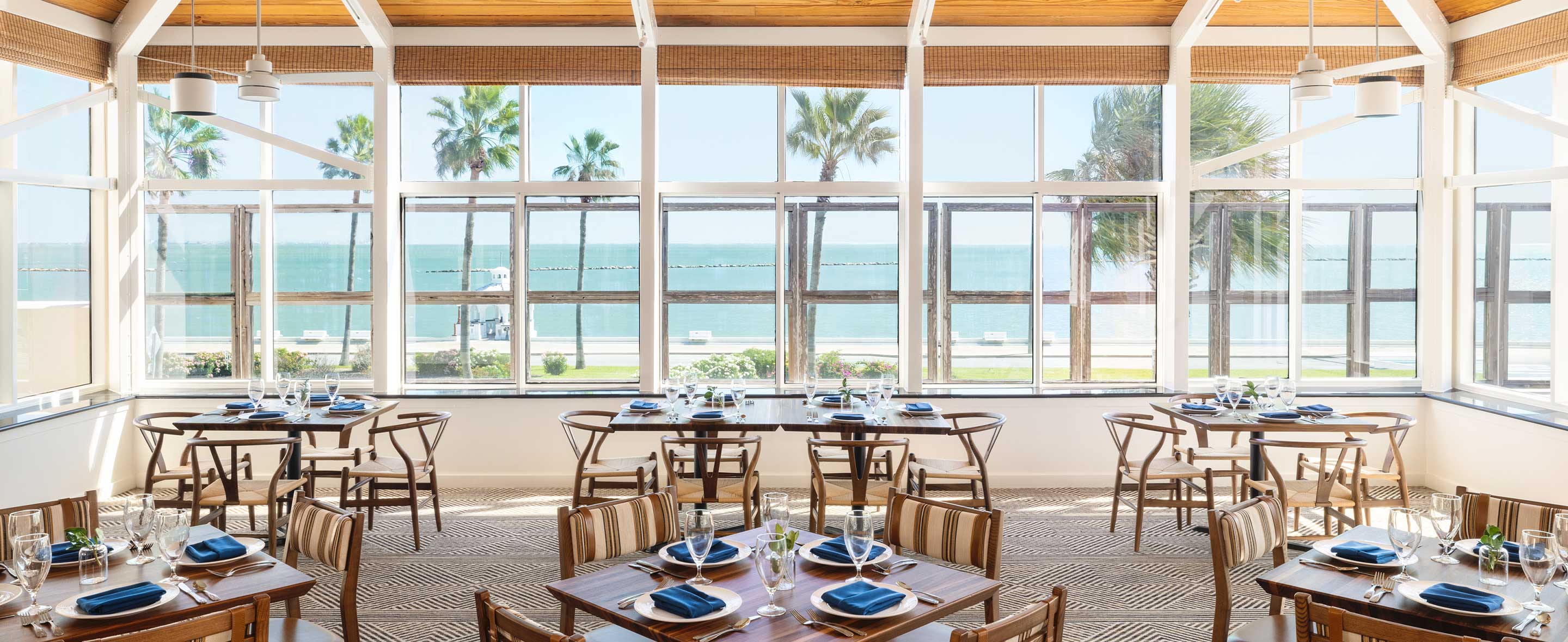 restaurant dining room with a beach view
