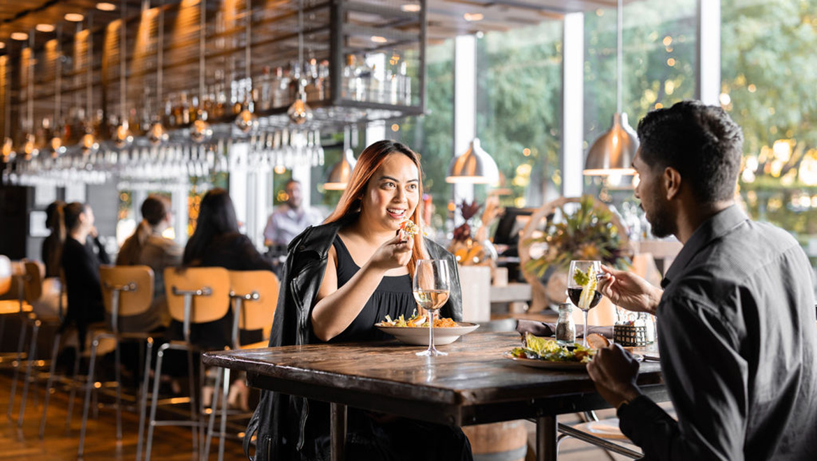 couple eating at Texas Spice at Omni Dallas Hotel