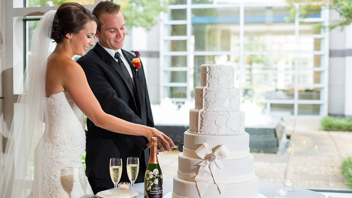 Newlyweds cutting cake