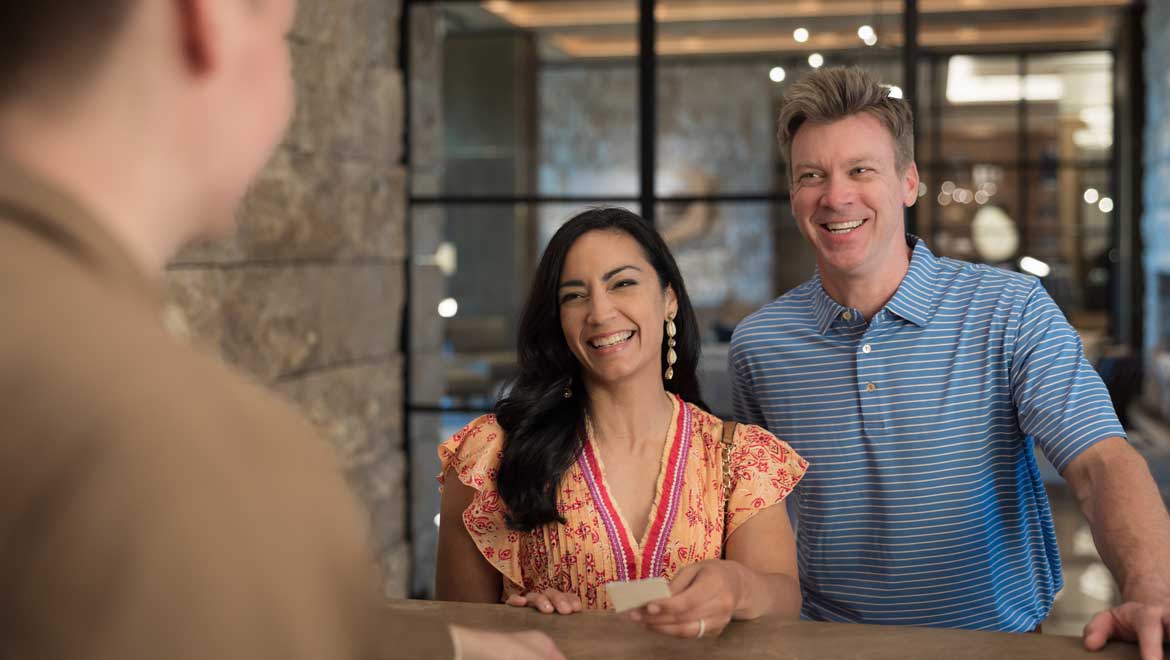 Couple at the registration desk.