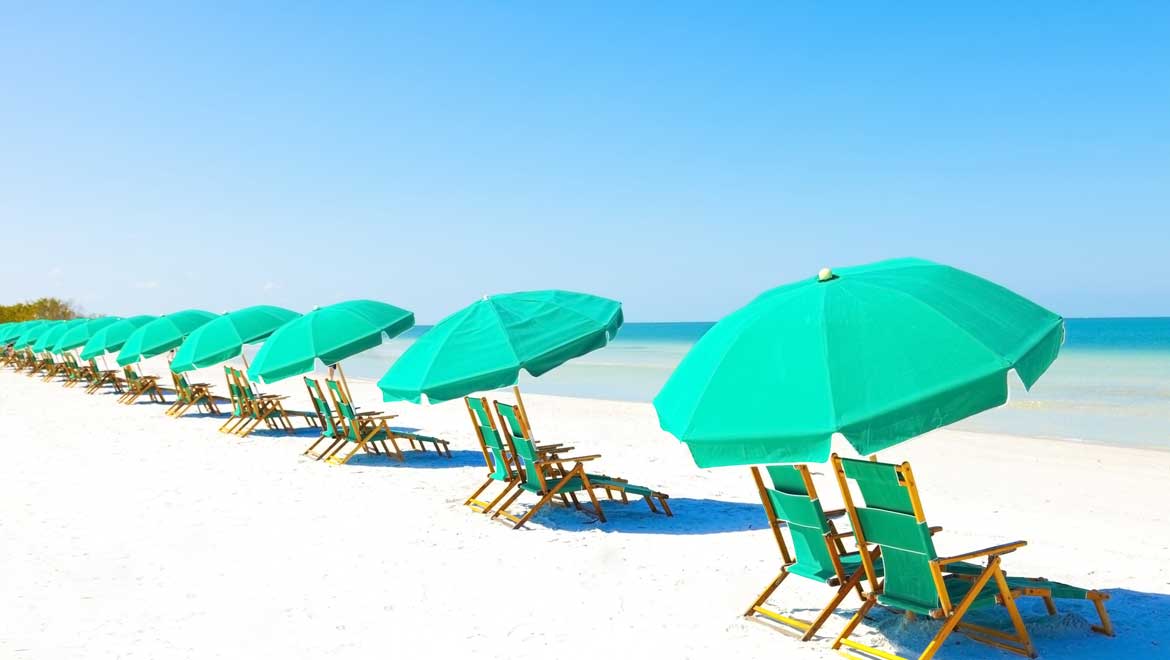 Lounge chairs and umbrellas on the beach.