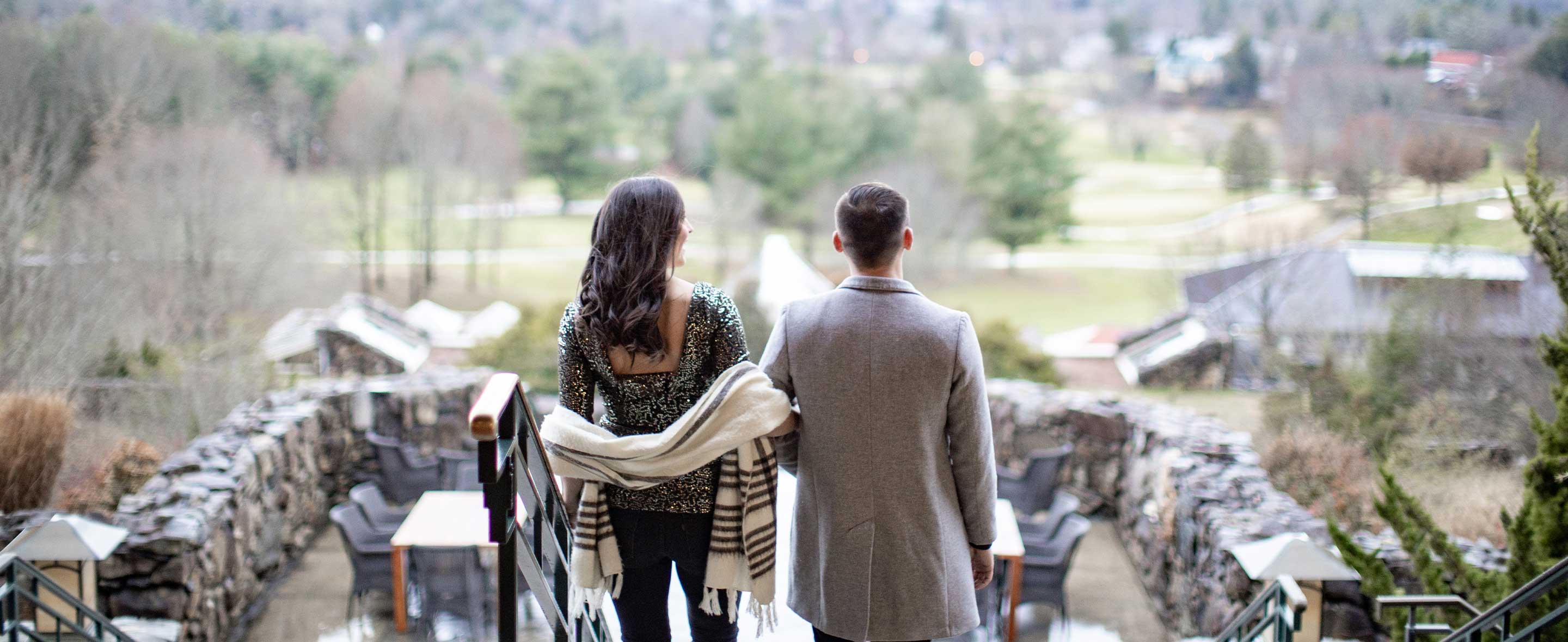Couple standing on staircase