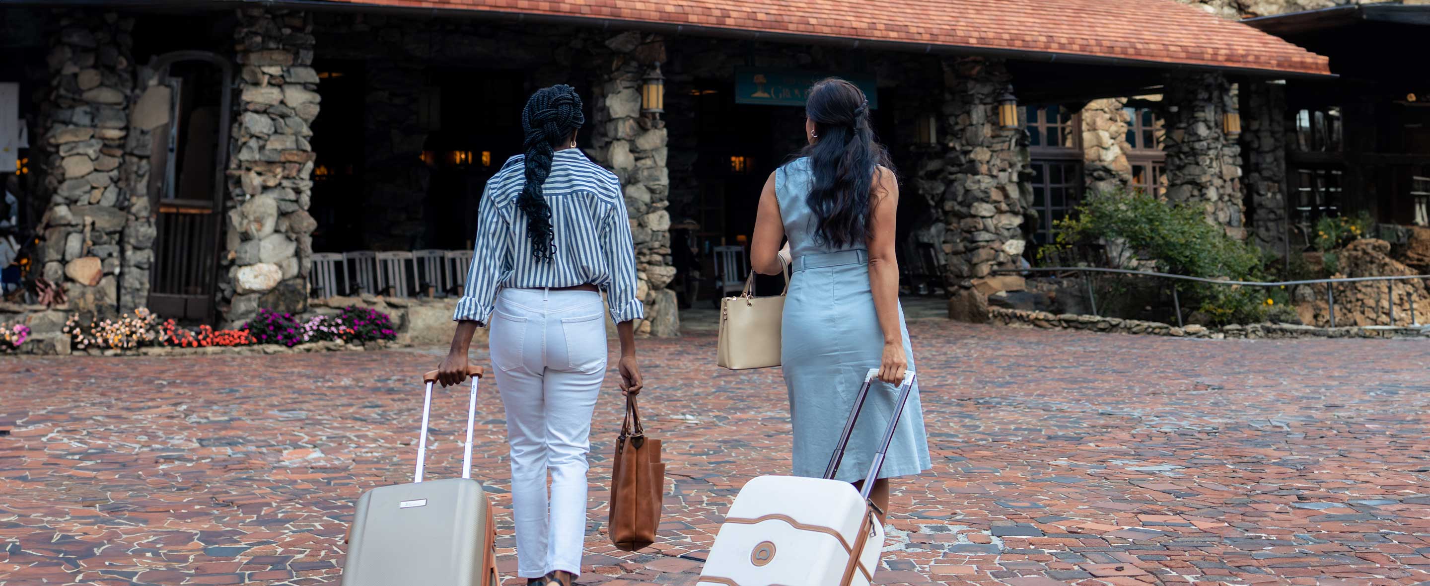 two women walking to resort entrance
