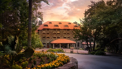 sunset arrival view of the historic Main Inn at The Omni Grove Park Inn