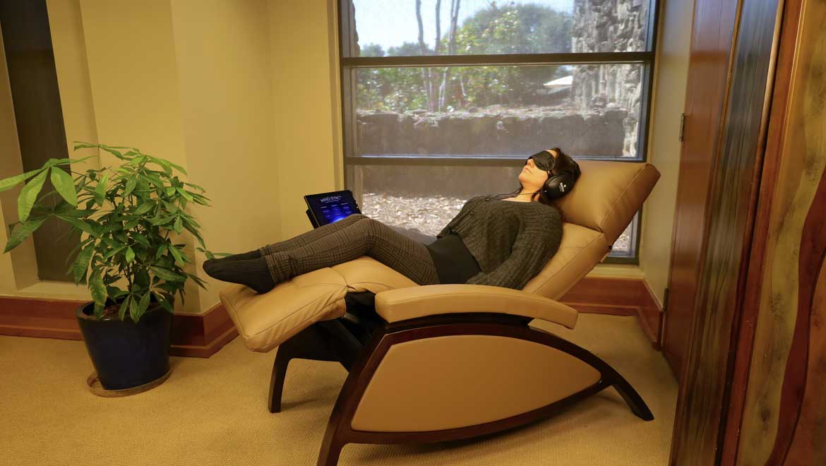 Woman relaxing in a lounge chair.