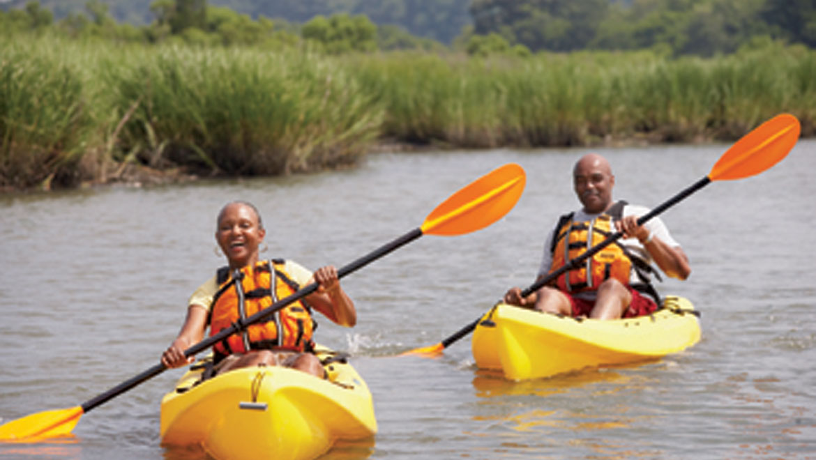 Father and daughter kayaking on the nearby 11-mile lagoon