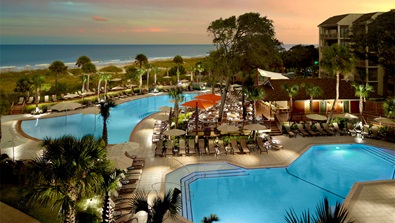 Overhead view of the family pools and Buoy Bar at sunset