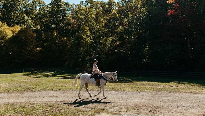 Woman riding horse