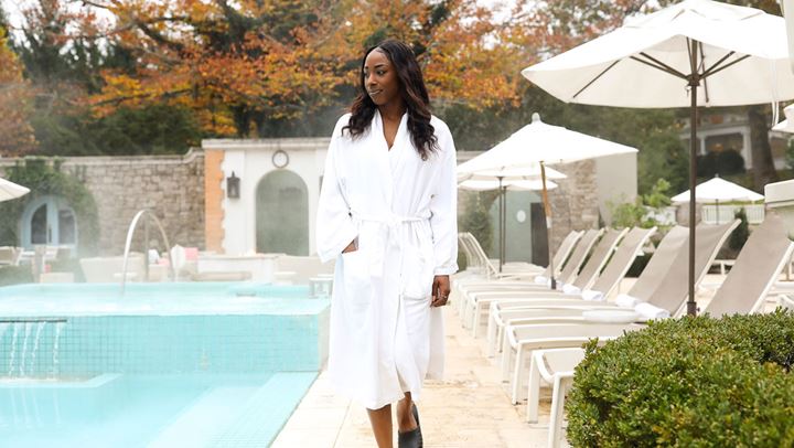 Woman walking around outdoor spa area