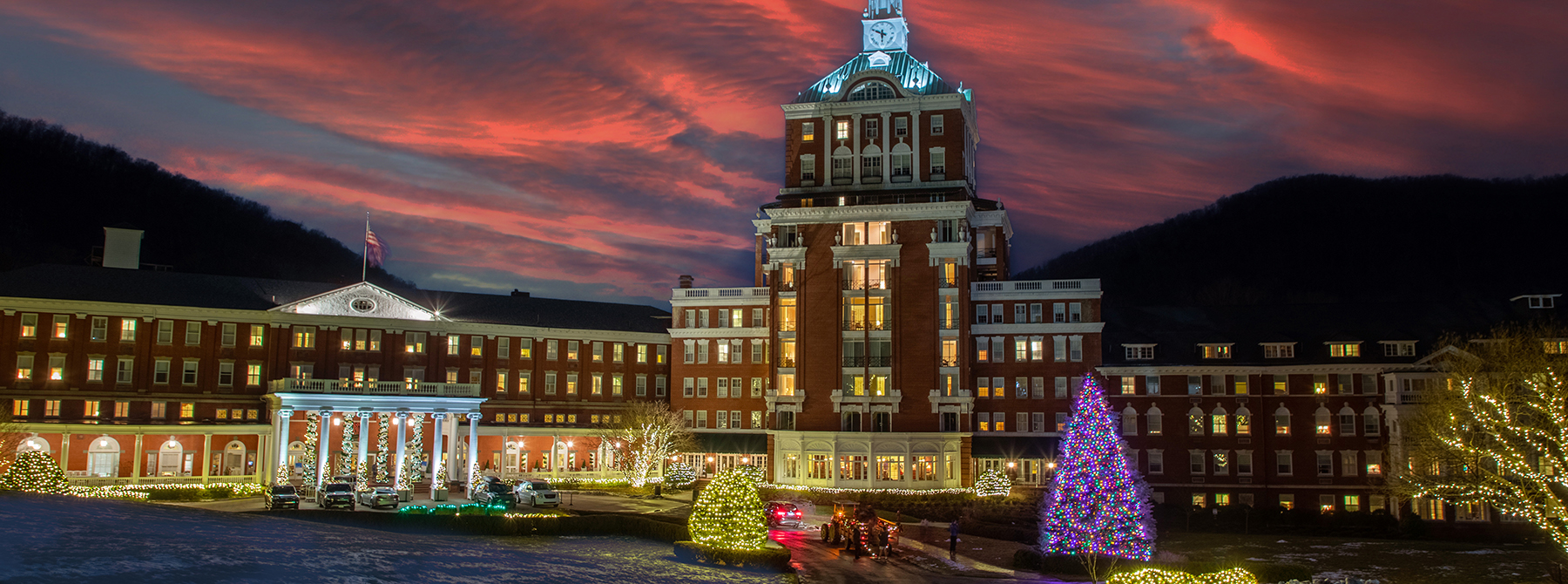 Property exterior with Christmas Trees lit up