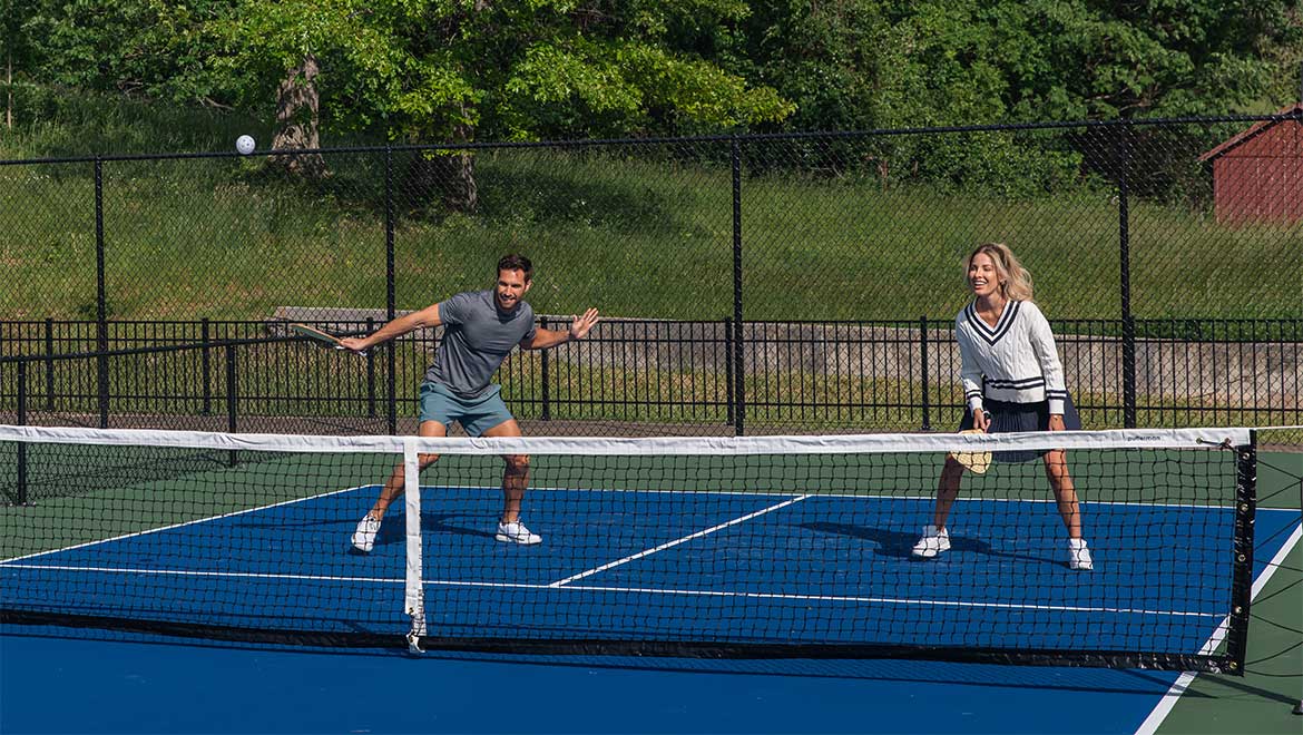 Couple playing pickleball
