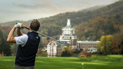Man golfing at Omni Homestead Resort