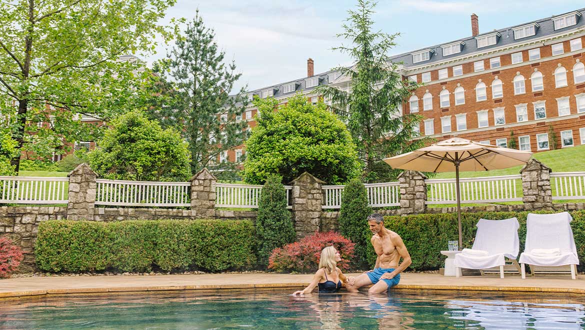 Couple relaxing by the pool