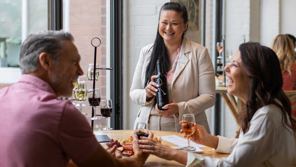 Server presenting wine.