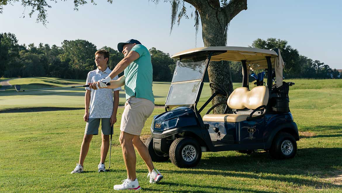 Father and son golfing