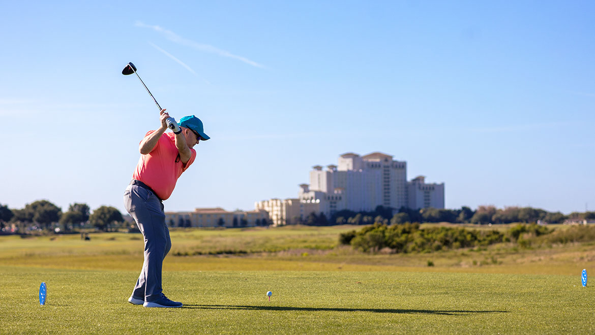 Golfer Swining at Omni Orlando Resort at ChampionsGate