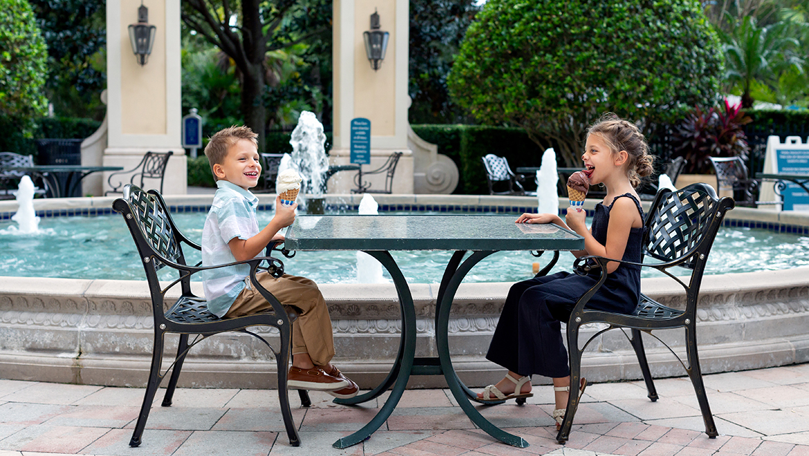 Kids eating ice cream at main fountain at Omni Orlando