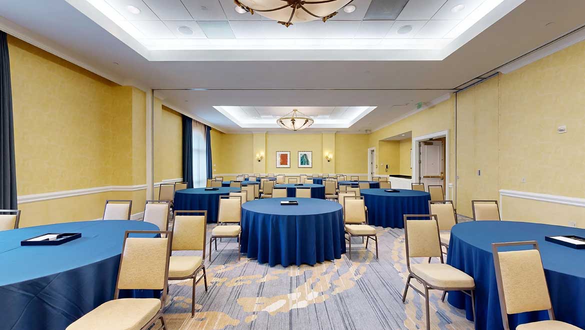 Meeting space with round tables.