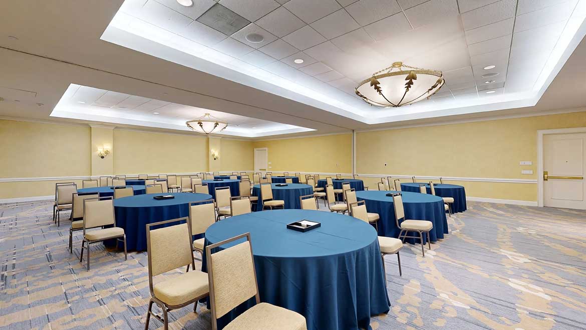 Meeting space with round tables.