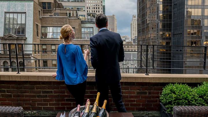 Couple enjoying view from terrace.