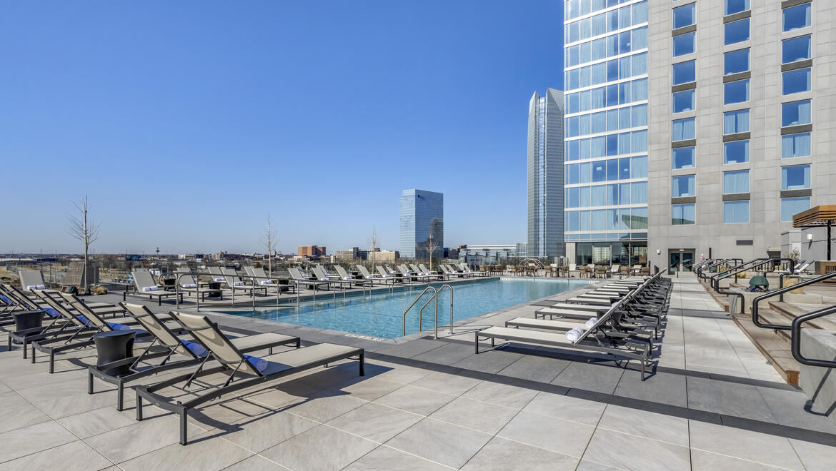 Outdoor pool area with lounge chairs