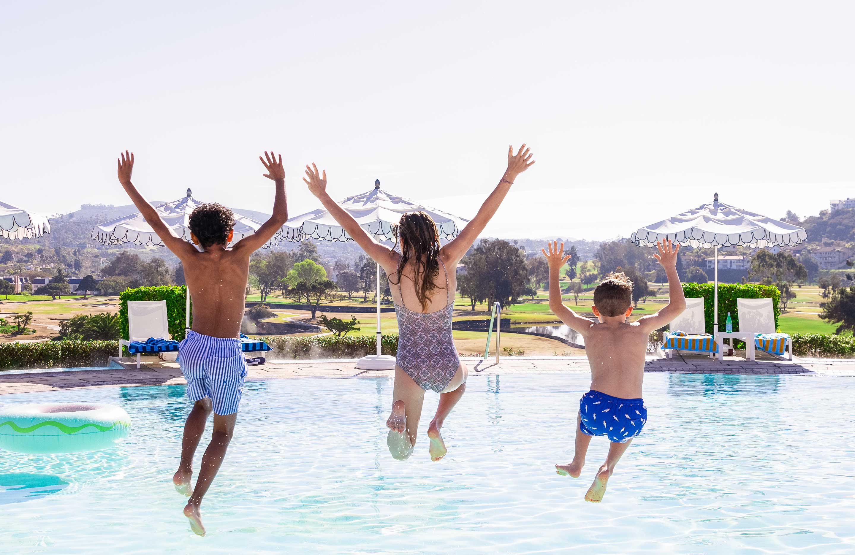 Kids jumping in the pool