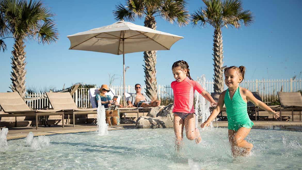 Little girls playing in the pool