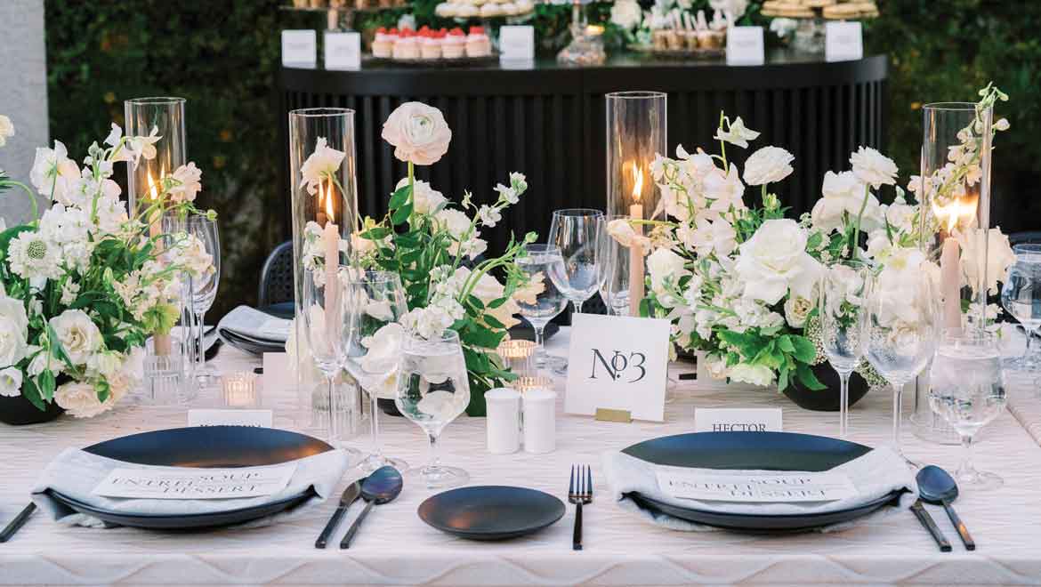 Plates and flowers at wedding reception